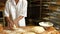 Female baker kneading a dough