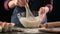 Female baker mixing batter with a whisk