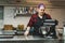 female baker with purple hair mixing products in a bowl at the kitchen, bakery, cooking concept