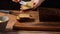 female baker spreading butter on homemade bread