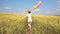 Female with balloons having fun in field in slowmo