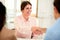 Female bank manager giving a hand greeting