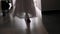Female bare feet walking down the hallway