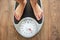 Female bare feet on weight scale