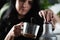 Female Barista Crafts Mocha Coffee
