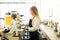 Female barista grinding some coffee