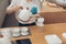 Female barista pouring boiled water through filter into glass mug