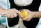 Female bartender peeling lemon