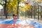 Female basketball player getting ready to make a ball throw to the basket.