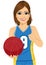Female basketball player holding ball and showing thumbs up