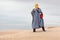 Female in bedouin clothes on dune