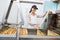 Female Beekeeper Holding Honeycomb Frame