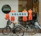 Female bicycles parked in front of Fashion store