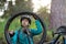 Female biker repairing mountain bike