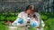 Female biologist works with a microscope in a glasshouse.