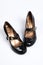 The female black varnished shoes