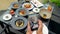 Female blogger hands capturing and record video of lunch using a smartphone