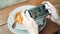 Female blogger photographing lunch in restaurant with her phone.