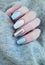 female blue hand manicure, stylish sweater winter creative