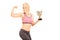 Female bodybuilder holding cup and showing bicep