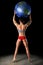 Female Bodybuilder Lifting Earth