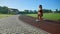 Female bodybuilder practicing lunges at stadium.