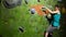 A female boulder trains to overcome obstacles on the wall for climbers. Professional rescuer. Climbing Wall. Slow motion