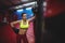 Female boxer leaning on punching bag