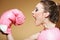 Female boxer model with big fun pink gloves