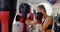 Female boxer practicing boxing in fitness studio 4k