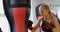 Female boxer practicing boxing in fitness studio 4k