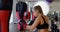 Female boxer practicing boxing in fitness studio 4k