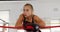 Female boxer standing in boxing ring 4k