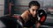 Female boxer training inside a boxing ring