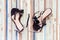 Female broken high heel shoes on grungy wooden background