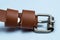 Female brown artificial leather belt on white background