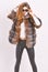 Female brown fur coat. Fur store model enjoy warm in soft fluffy coat with collar. Woman wear sunglasses and hairstyle