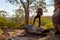 Female bushwalker with backpack walking in Australian bushland