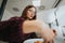 Female business person enjoying refreshing pizza break.