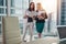 Female businesswomen wearing formal outfit discussing documents standing in office hallway