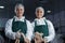 Female butchers processing sausages