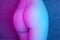 Female buttocks in pink-blue lighting