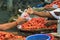 Female buyer paying with cash after buying vegetables at the Male market in Maldives