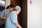 Female caregiver is helping support elderly woman walk into the restroom carefully,asian senior with bladder control problem need