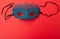 Female carnival mask on a red background. Mystery, incognito, seduction concept. Place for your text