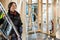 Female Carpenter Carrying Ladder At Construction Site