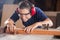 Female Carpenter Cutting Wood With Tablesaw