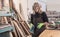 Female carpenter Using Electric Sander