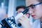 Female caucasian scientist wearing protective glasses  in laboratory