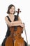 Female Cellist Sits With Arms Folded Across Cello